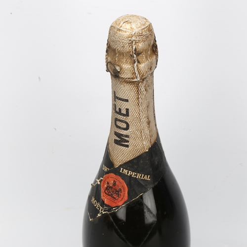 204 - A bottle of 1953 Moet & Chandon Dry Imperial Champagne