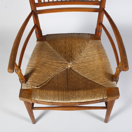 223 - A 19th century rush-seated Sussex chair, with Arts and Crafts cushion, height 86cm