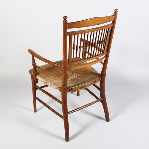 223 - A 19th century rush-seated Sussex chair, with Arts and Crafts cushion, height 86cm