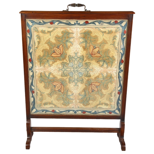 227 - A large 19th century Arts and Crafts walnut fire screen, with original embroidered panel, in the man... 