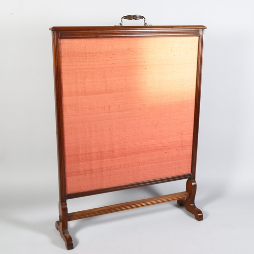 227 - A large 19th century Arts and Crafts walnut fire screen, with original embroidered panel, in the man... 