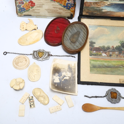 245 - An early 20th century collection of artwork by Mrs G Constance, including bone carvings with origina... 