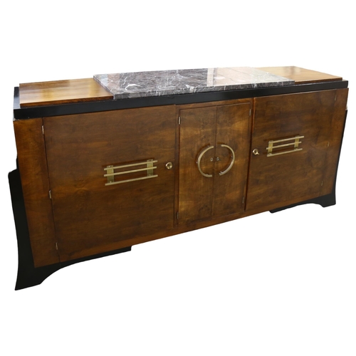 262 - A large Art Deco walnut sideboard, in Bauhaus style, with ebonised sides and plinth and marble centr... 