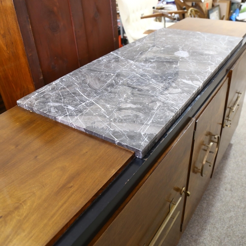 262 - A large Art Deco walnut sideboard, in Bauhaus style, with ebonised sides and plinth and marble centr... 