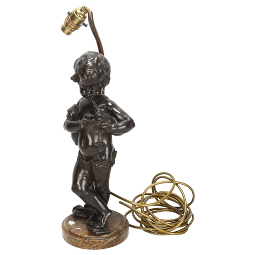 269 - An Antique bronze cherub sculpture playing pipes, on marble base with lamp fitting, bronze height 37... 