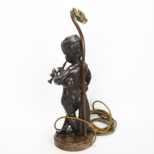 269 - An Antique bronze cherub sculpture playing pipes, on marble base with lamp fitting, bronze height 37... 