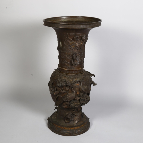 277 - An Antique Chinese large cast-bronze vase in 2 sections, with birds and plants in high relief, heigh... 