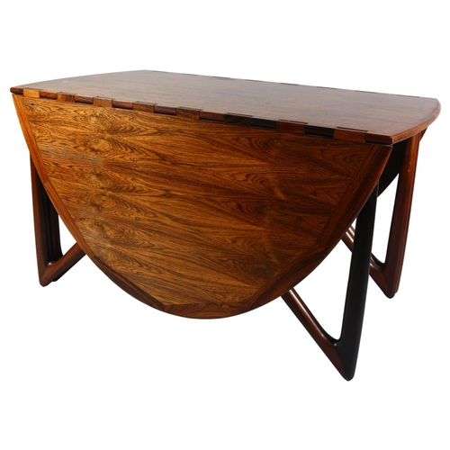 400 - Kurt Ostervig for Jason Mobler, Denmark, a 1960s' designed rosewood drop leaf dining table with inte... 