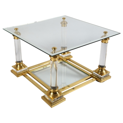 404 - A 1950s' Maison Charles coffee table, with Lucite and gilt frame, mirrored edge glass top and shelf,... 