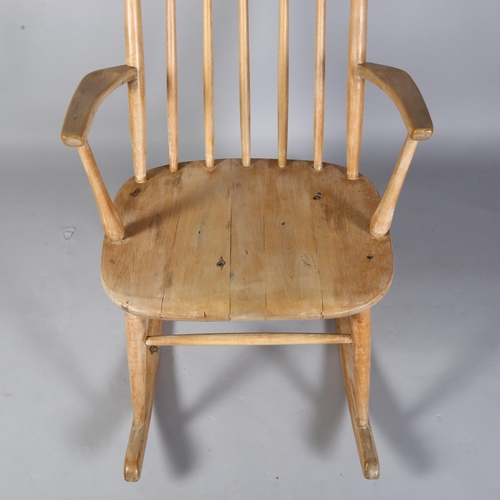 494 - Aksel Hansson, Norway, a 1930's pine rocking chair with straw seat, no makers marks, height 80cm