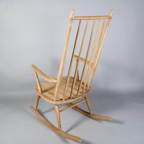 494 - Aksel Hansson, Norway, a 1930's pine rocking chair with straw seat, no makers marks, height 80cm