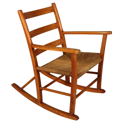 495 - A 1960s' Scandinavian rocking chair, height 110cm