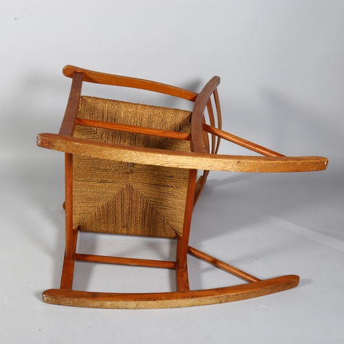 495 - A 1960s' Scandinavian rocking chair, height 110cm