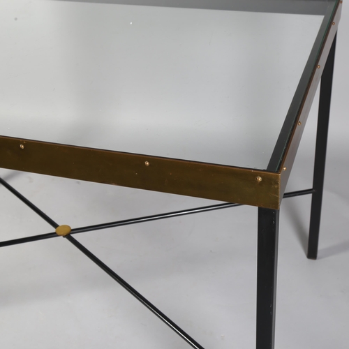 521 - A mid-century Italian iron and brass table with glass top and cross stretcher, 116 x 70cm, height 74... 