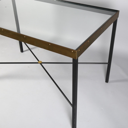 521 - A mid-century Italian iron and brass table with glass top and cross stretcher, 116 x 70cm, height 74... 