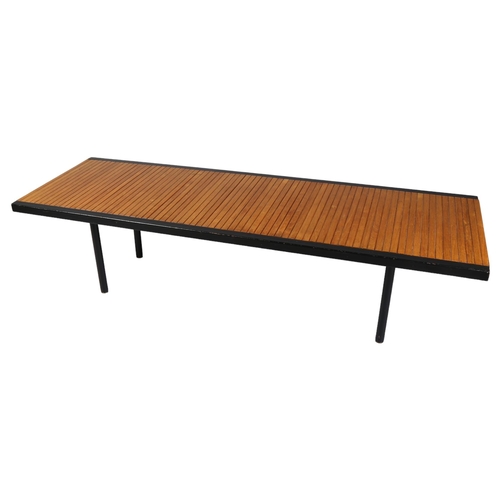 522 - A mid-century teak and iron coffee table, of teak block construction bound with iron edging, British... 