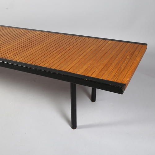 522 - A mid-century teak and iron coffee table, of teak block construction bound with iron edging, British... 