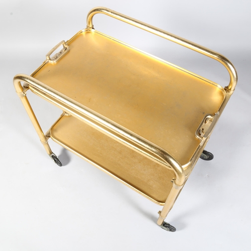 531 - A mid-century Lumium anodised aluminium folding trolley or bar cart, with removeable trays, and make... 