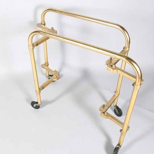 531 - A mid-century Lumium anodised aluminium folding trolley or bar cart, with removeable trays, and make... 