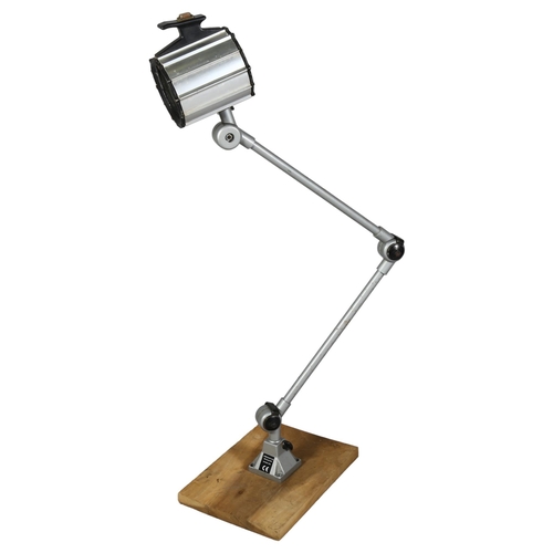 540 - A bench mount articulated medical/industrial lamp with halogen fitting, extended height 110cm