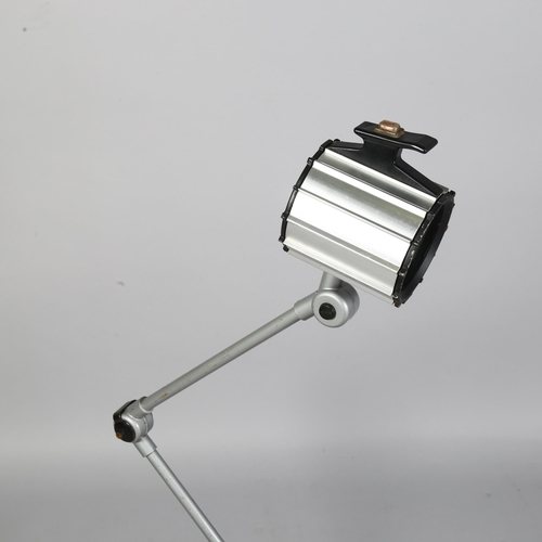 540 - A bench mount articulated medical/industrial lamp with halogen fitting, extended height 110cm