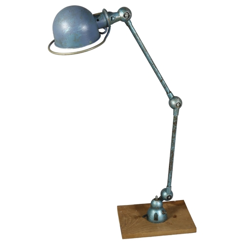 541 - A 1950s' Jielde, French industrial bench mount lamp, with makers label, extended height 110cm