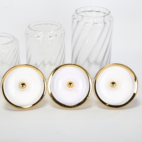 406 - A graduated set of 3 Hollywood Regency style glass cylinder jars, with gilded metal lid and frosted ... 