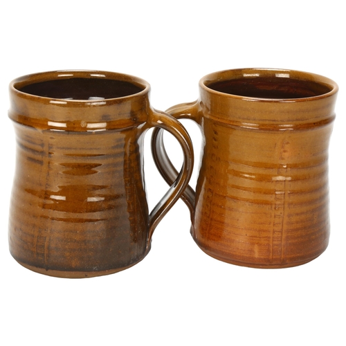 411 - Clive Bowen, a pair of studio pottery mugs, makers mark to base, height 10.5cm