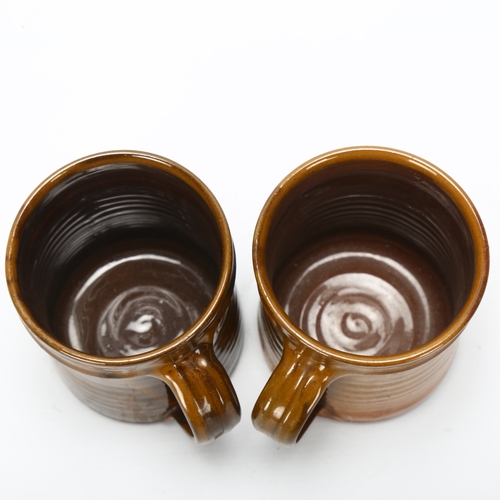 411 - Clive Bowen, a pair of studio pottery mugs, makers mark to base, height 10.5cm