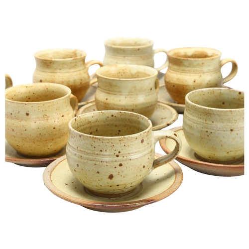 412 - Ray Finch for Winchcombe Pottery, a set of 9 stoneware cups and saucers, pottery and makers mark to ... 