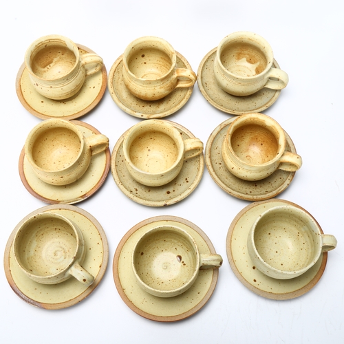 412 - Ray Finch for Winchcombe Pottery, a set of 9 stoneware cups and saucers, pottery and makers mark to ... 