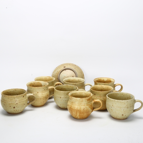 412 - Ray Finch for Winchcombe Pottery, a set of 9 stoneware cups and saucers, pottery and makers mark to ... 