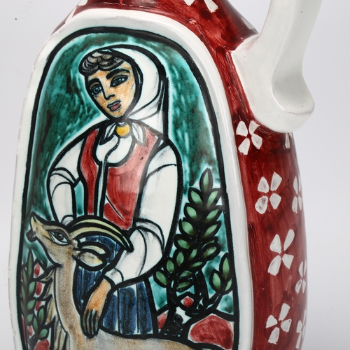 435 - Erik Ploen (1925-2004), Norway, a hand painted stoneware jug, girl and goat, signed to base, height ... 