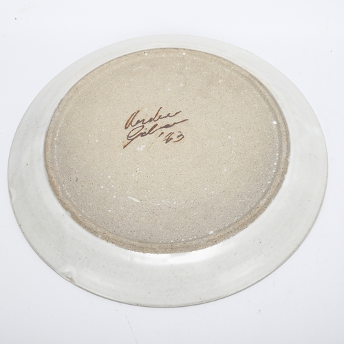 454 - A studio pottery plate with abstract design, signed to base, diameter 28cm