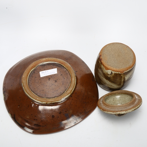 477 - Mike Dodd, a square section tenmoku glaze plate and an early storage jar, makers mark to indistinct ... 