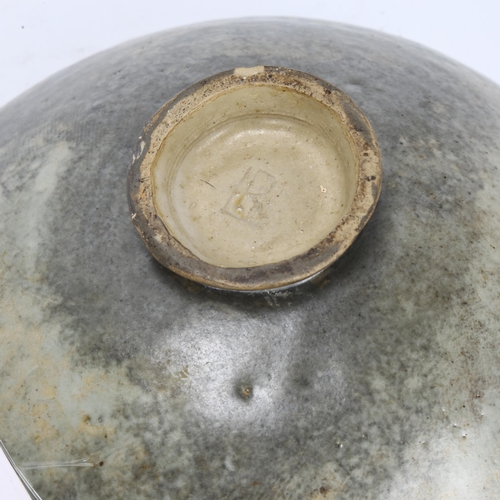 524 - A mid-century footed studio pottery centre bowl, with combed exterior and splash glaze interior, mak... 