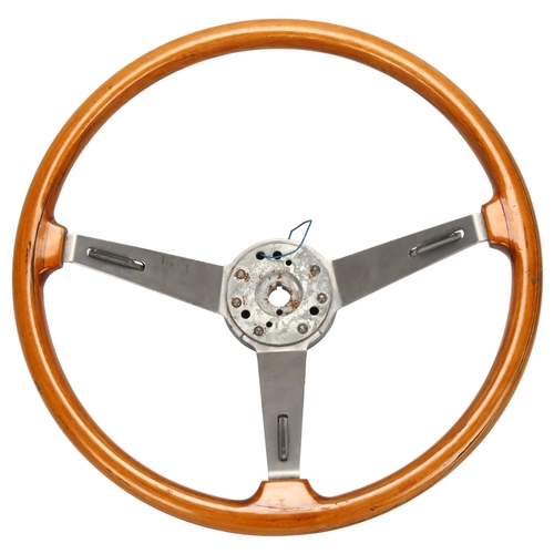 525 - An Alfa Romeo steering wheel and user manual for GT Junior, engraved on metal 