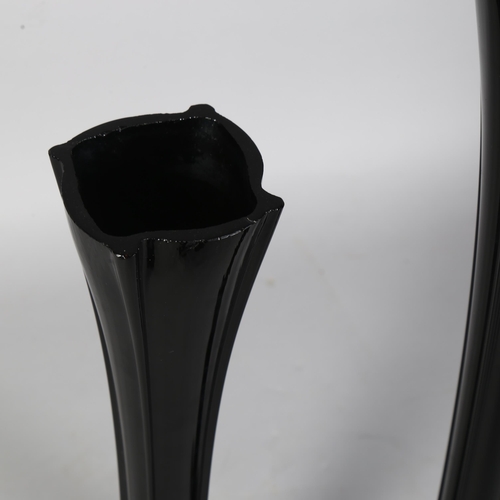 438 - 2 large mid-century black glass stem vases, tallest 82cm