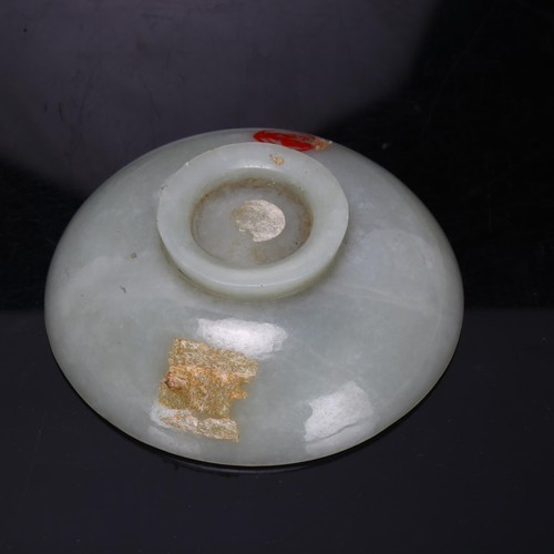 178 - A Chinese jade carved footed bowl, with paint seal to underside, diameter 10cm