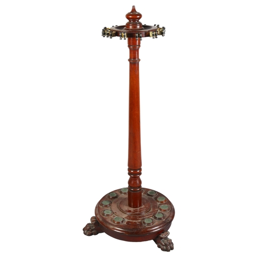 228 - A Victorian mahogany cue stand, fitted to hold 12 cues, raised on 3 carved paw feet, height 112cm