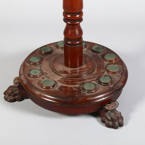 228 - A Victorian mahogany cue stand, fitted to hold 12 cues, raised on 3 carved paw feet, height 112cm