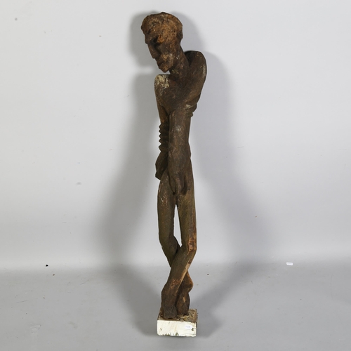 855 - In the manner of Georg Baselitz (German b.1938), a wooden carved figural sculpture on a square woode... 