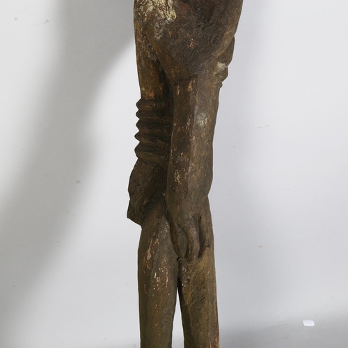 855 - In the manner of Georg Baselitz (German b.1938), a wooden carved figural sculpture on a square woode... 