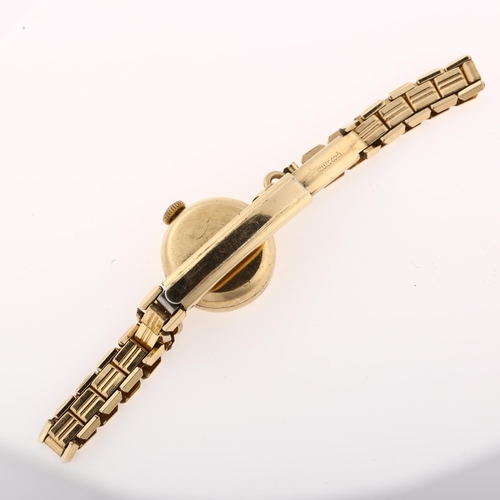 1032 - OMEGA - a lady's 9ct gold mechanical bracelet watch, ref. 66803, circa 1959, silvered dial with gilt... 