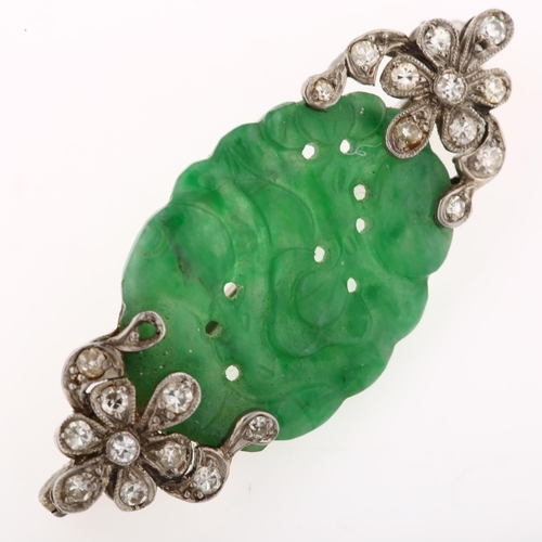 1103 - An Art Deco jade and diamond brooch, circa 1930, unmarked white metal settings with carved and pierc... 