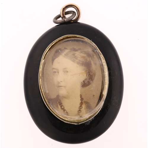 1114 - A Victorian black onyx pearl and diamond locket pendant, circa 1890, with central concave flowerhead... 