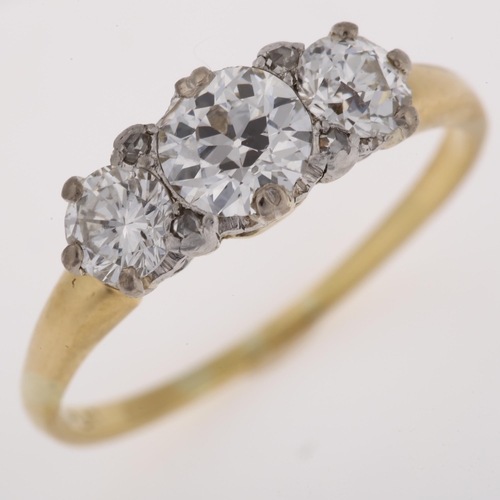 1116 - An 18ct gold three stone diamond ring, set with old European and modern round brilliant-cut diamonds... 