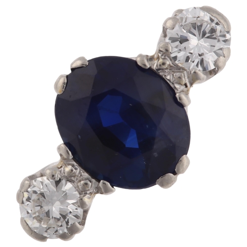 1129 - A late 20th century 18ct white gold three stone sapphire and diamond ring, platinum-topped set with ... 