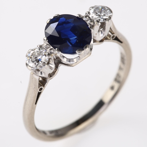 1129 - A late 20th century 18ct white gold three stone sapphire and diamond ring, platinum-topped set with ... 