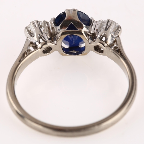 1129 - A late 20th century 18ct white gold three stone sapphire and diamond ring, platinum-topped set with ... 